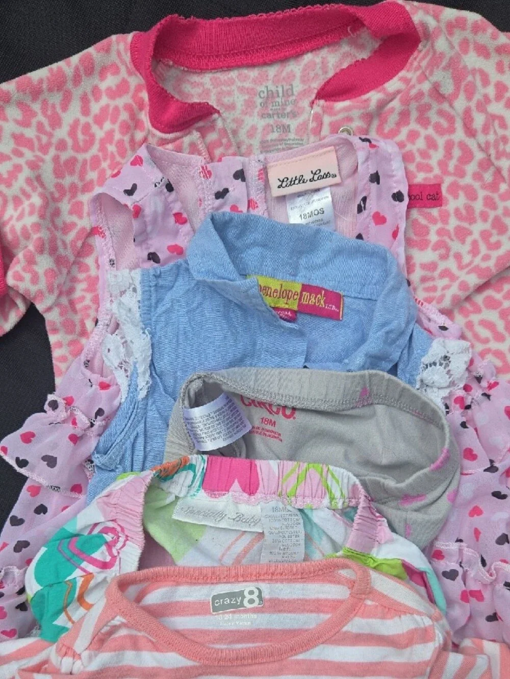 Lot of 7 pieces of girls clothes, tops, dresses, and bottoms.